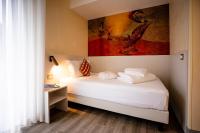 Posteľ alebo postele v izbe v ubytovaní Hotel Arizona
