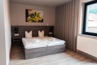 Posteľ alebo postele v izbe v ubytovaní Hotel Zur Schonenburg