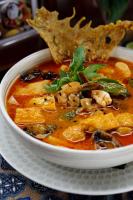 a bowl of soup with a piece of food in it at Unagi Wooden Villas by Emana in Ubud