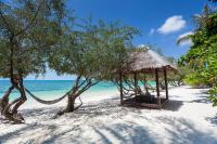 a gazebo on a beach with the ocean at Sarikantang Resort & Spa, Koh Phangan in Haad Rin
