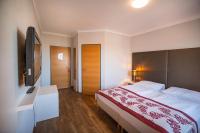Posteľ alebo postele v izbe v ubytovaní Arion Airport Hotel