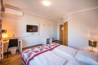 Posteľ alebo postele v izbe v ubytovaní Arion Airport Hotel