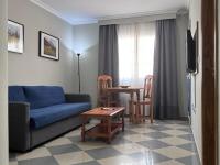 Posedenie v ubytovaní Apartamentos Niña de Oro