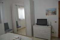 Televízia a/alebo spoločenská miestnosť v ubytovaní Giu Al Mar - Apartment