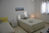 Posteľ alebo postele v izbe v ubytovaní Giu Al Mar - Apartment