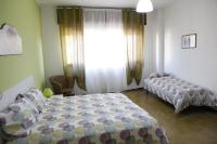 A bed or beds in a room at Comeacasatua