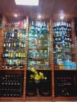 a room with a large amount of bottles of wine at CITI HOTEL in Hilongos