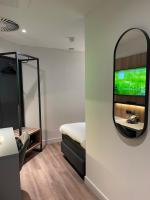 OZO Hotels Antares Airportにあるテレビまたはエンターテインメントセンター