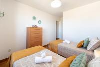 A bed or beds in a room at Bonito Piso a 1 minuto de la Playa