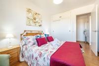 A bed or beds in a room at Bonito Piso a 1 minuto de la Playa
