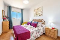 A bed or beds in a room at Bonito Piso a 1 minuto de la Playa