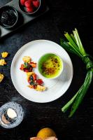 a plate of food with a bowl of soup on a table at The Gainsborough Bath Spa - Small Luxury Hotels of the World in Bath