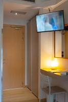 Televízia a/alebo spoločenská miestnosť v ubytovaní Hotel Savoia