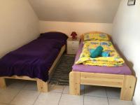 Postel nebo postele na pokoji v ubytování Napfény Ház Sonnenschein Haus