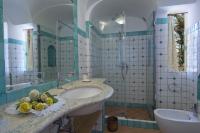 a bathroom with a sink and a mirror at Villa Ambra Positano in Positano