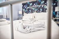 Posteľ alebo postele v izbe v ubytovaní Penta Apartments