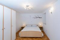 Postel nebo postele na pokoji v ubytování Apartment Ema