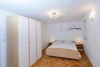 Postel nebo postele na pokoji v ubytování Apartment Ema