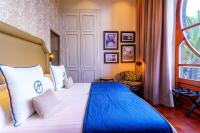 Postel nebo postele na pokoji v ubytování Boutique Hotel Cordial Plaza Mayor de Santa Ana