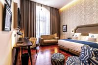 Postel nebo postele na pokoji v ubytování Boutique Hotel Cordial Plaza Mayor de Santa Ana