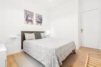 A bed or beds in a room at Barcelona coast apartment - only 5 minutes to the beach