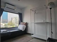 Postel nebo postele na pokoji v ubytování โรงแรมแอเรียเพลส สาทร (AREA Place)