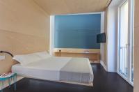 Posteľ alebo postele v izbe v ubytovaní Fiveplace Design Suites & Apartments