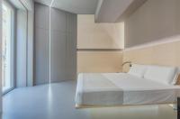 Posteľ alebo postele v izbe v ubytovaní Fiveplace Design Suites & Apartments