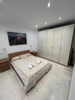 Postel nebo postele na pokoji v ubytování La Piccola Cadiz