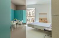 Posteľ alebo postele v izbe v ubytovaní Fiveplace Design Suites & Apartments