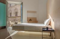 Posteľ alebo postele v izbe v ubytovaní Fiveplace Design Suites & Apartments