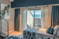 Postel nebo postele na pokoji v ubytování Royal Wings Hotel