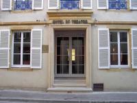 a front door of a building with white windows at Hôtel Du Théâtre Centre Historique Parking Gratuit in Metz