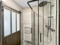 a shower with a glass door in a bathroom at Studio entre Bordeaux et l&#39;Atlantique in Saint-Médard-en-Jalles