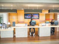 three women sitting at a counter in a store at ibis Itu Plaza Shopping in Itu