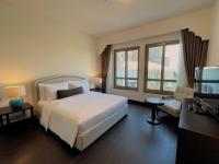 Ein Bett oder Betten in einem Zimmer der Unterkunft Oaks Ibn Battuta Gate Dubai