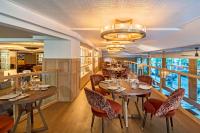 A restaurant or other place to eat at NH Collection Madrid Suecia