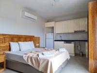 Postel nebo postele na pokoji v ubytování My Solmaz Hotel
