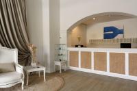 Televízia a/alebo spoločenská miestnosť v ubytovaní Paradise Art Hotel
