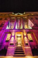 a building with purple lights on the front of it at The Gainsborough Bath Spa - Small Luxury Hotels of the World in Bath