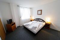 Postel nebo postele na pokoji v ubytování Hotel Peliny