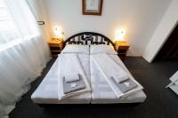 Postel nebo postele na pokoji v ubytování Hotel Peliny