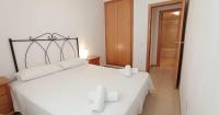 Posteľ alebo postele v izbe v ubytovaní Apartament Nuria