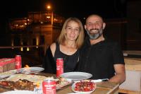 Ein Mann und eine Frau sitzen an einem Tisch mit Essen in der Unterkunft Cappadocia Fairy Tale Suites in Goreme