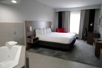 Ein Bett oder Betten in einem Zimmer der Unterkunft Country Inn &amp; Suites by Radisson, Council Bluffs, IA