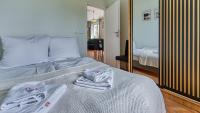 Posteľ alebo postele v izbe v ubytovaní Apartament Winter Feel z prywatną SAUNĄ - 5D Apartments