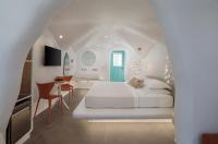 Naxos Cave Suitesにあるベッド