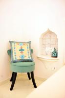 a pillow sitting on a chair in a room at Casa Mulini in Positano