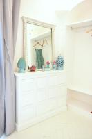 a white dresser in a room with a mirror at Casa Mulini in Positano