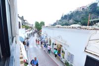 a group of people walking down a street at Casa Mulini in Positano
